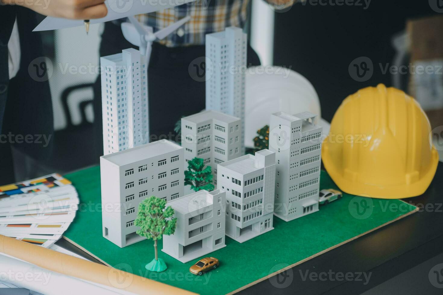 Construction and structure concept of Engineer or architect meeting for project working with partner and engineering tools on model building and blueprint in working site, contract for both companies. photo