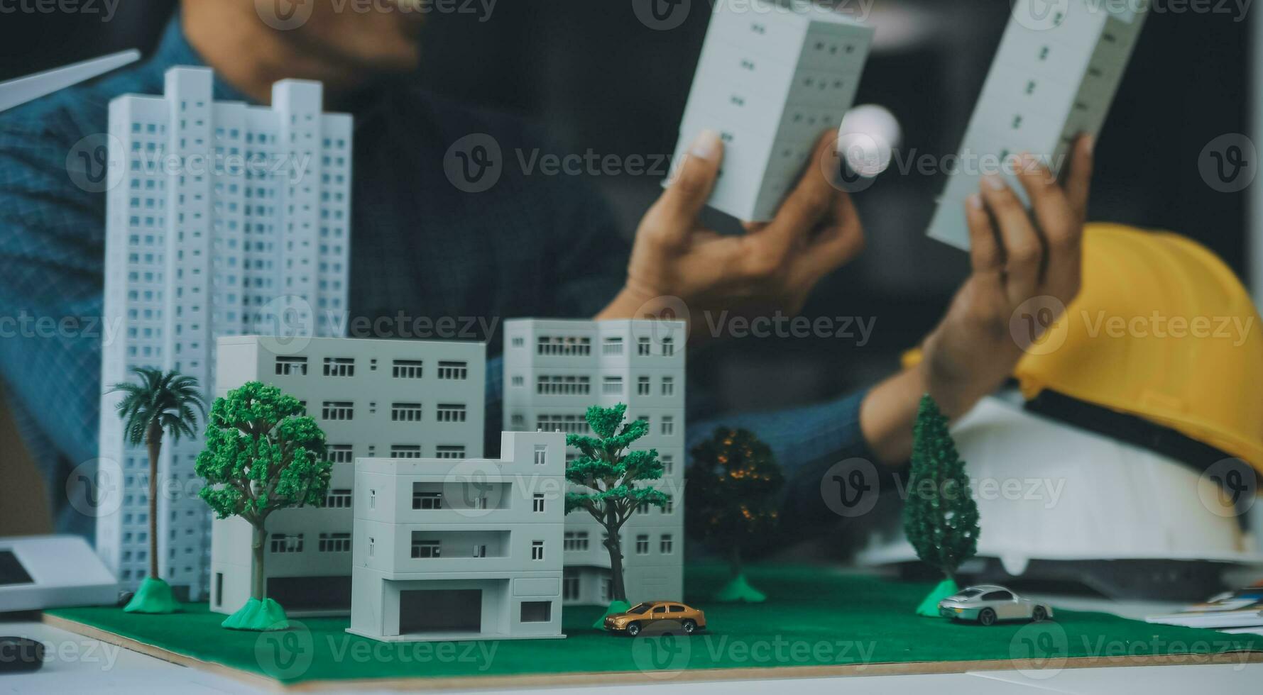 Construction and structure concept of Engineer or architect meeting for project working with partner and engineering tools on model building and blueprint in working site, contract for both companies. photo