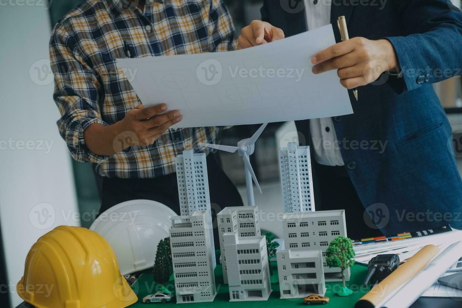 Construction and structure concept of Engineer or architect meeting for project working with partner and engineering tools on model building and blueprint in working site, contract for both companies. photo