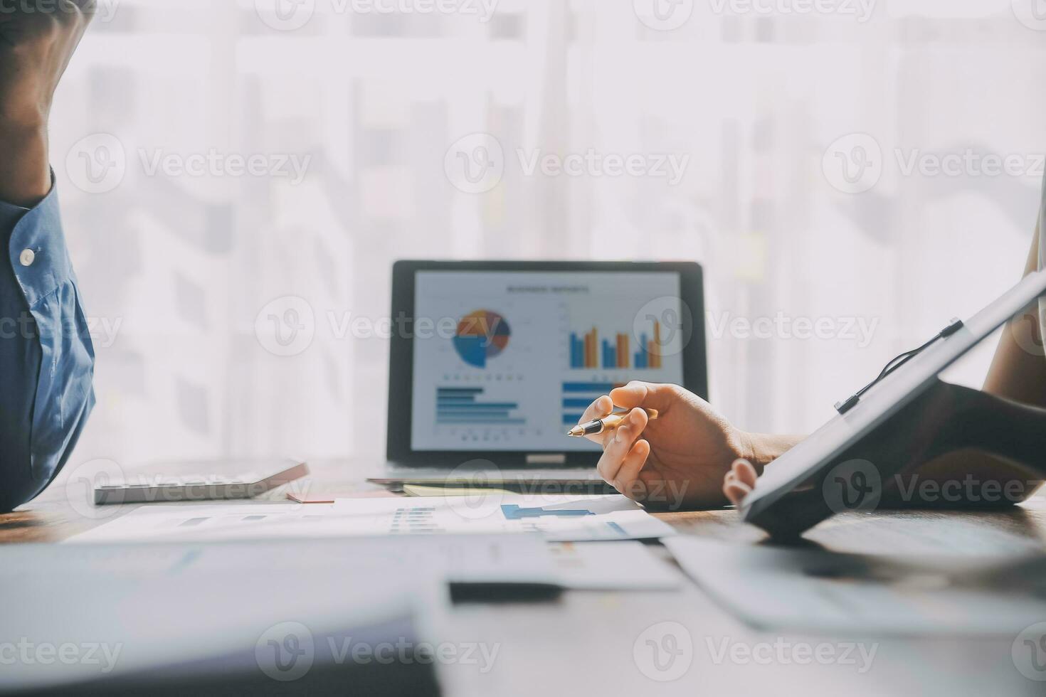 Close up of Business team analyzing income charts and graphs with modern laptop computer. Business analysis and strategy concept. photo