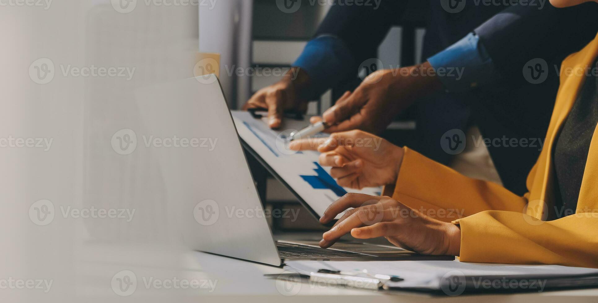 Close up of Business team analyzing income charts and graphs with modern laptop computer. Business analysis and strategy concept. photo