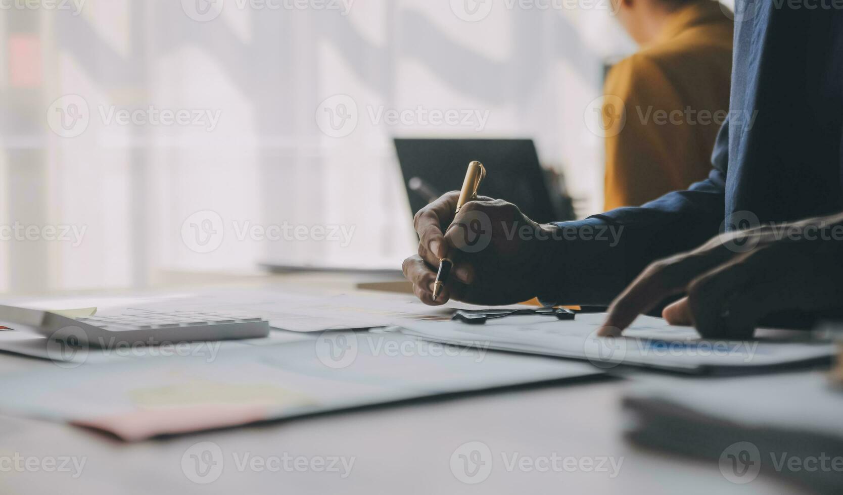 Close up of Business team analyzing income charts and graphs with modern laptop computer. Business analysis and strategy concept. photo