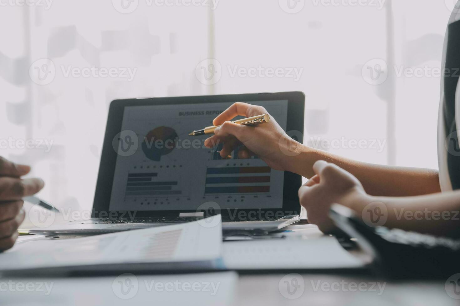 Close up of Business team analyzing income charts and graphs with modern laptop computer. Business analysis and strategy concept. photo