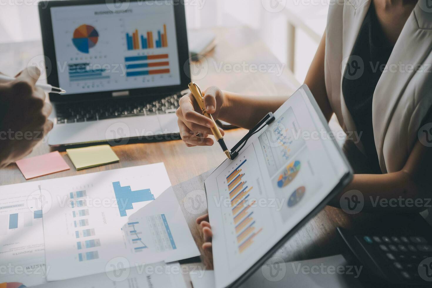 Close up of Business team analyzing income charts and graphs with modern laptop computer. Business analysis and strategy concept. photo
