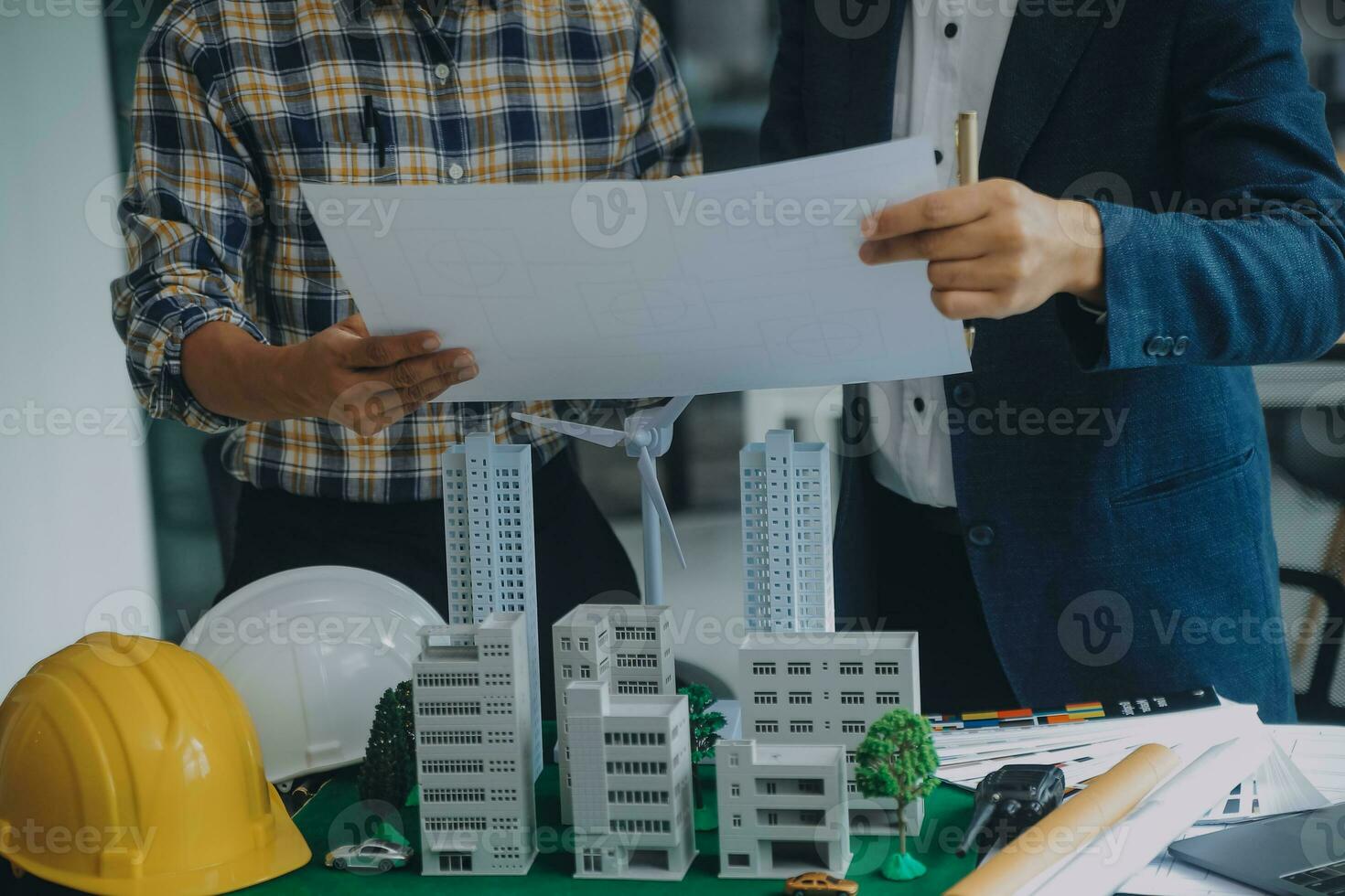 Construction and structure concept of Engineer or architect meeting for project working with partner and engineering tools on model building and blueprint in working site, contract for both companies. photo