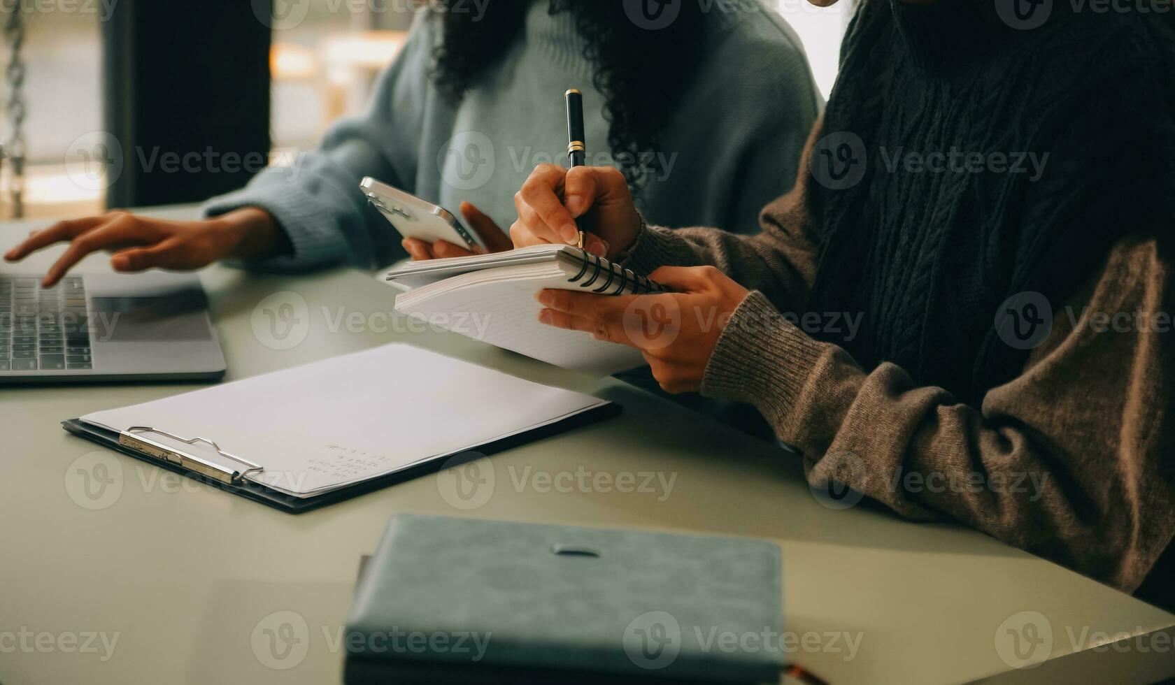 Asian businesswoman working on laptop computer Look for job online, freelance looking and typing on notebook on table, lifestyle of woman studying online photo