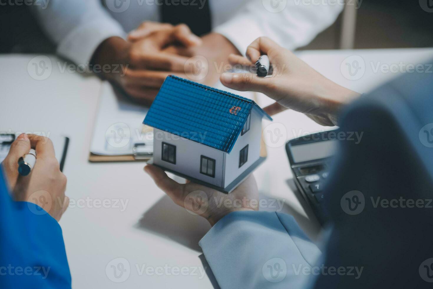 Real estate agent and customer signing contract to buy house, insurance or loan real estate.rent a house,get insurance or loan real estate or property. photo
