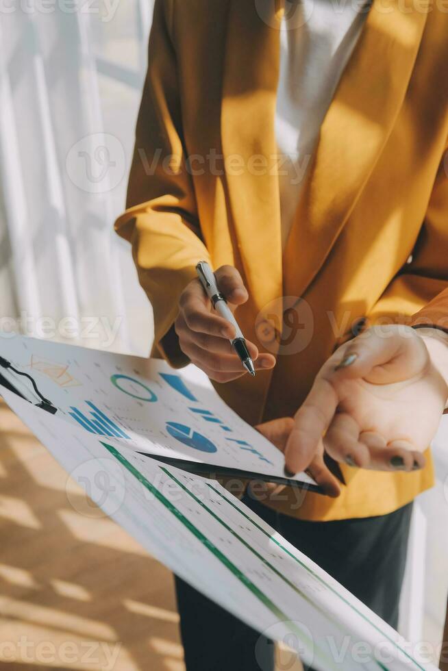 Team of business people working together in the meeting room office, teamwork background charts and graphs banner, double exposure successful teamwork,business planning concept. photo