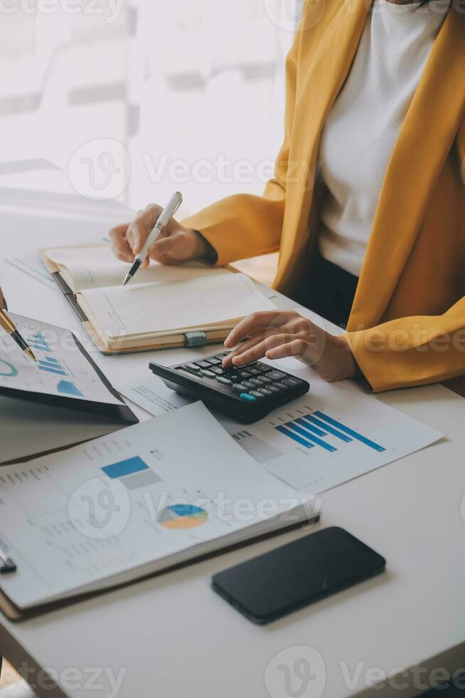 Team of business people working together in the meeting room office, teamwork background charts and graphs banner, double exposure successful teamwork,business planning concept. photo