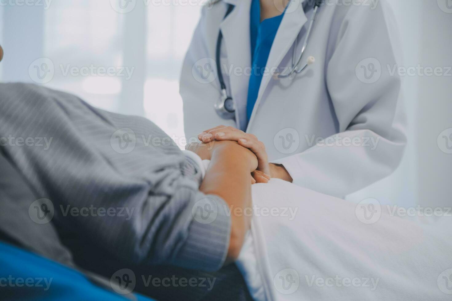 Doctor taking care, help and encourage Asian elder senior woman patient in clinic hospital. photo