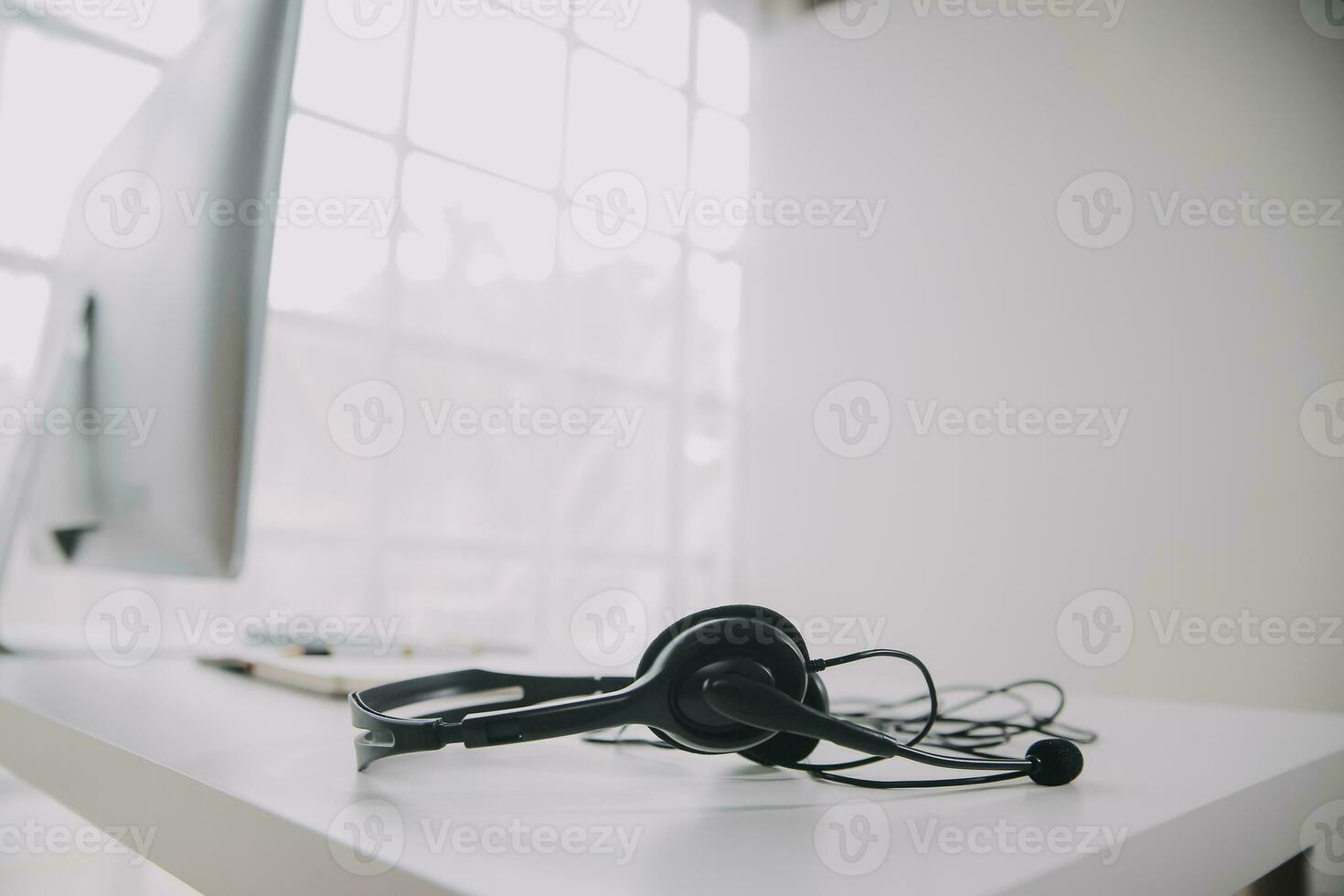 Communication support, call center and customer service help desk. VOIP headset on telephone keyboard. photo