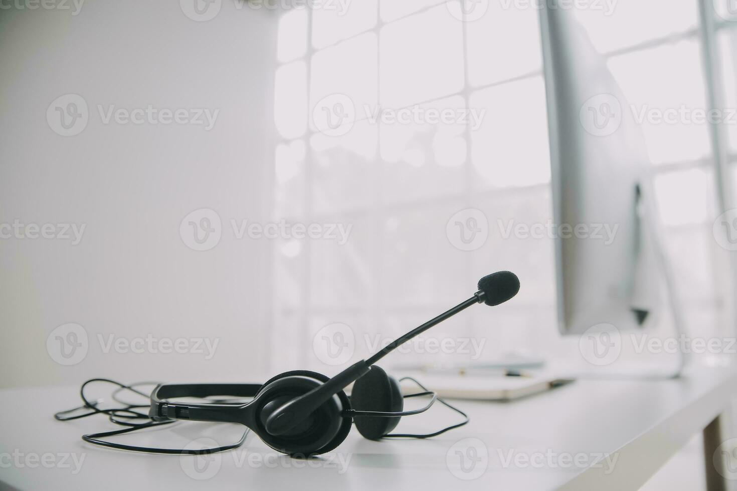 Communication support, call center and customer service help desk. VOIP headset on telephone keyboard. photo