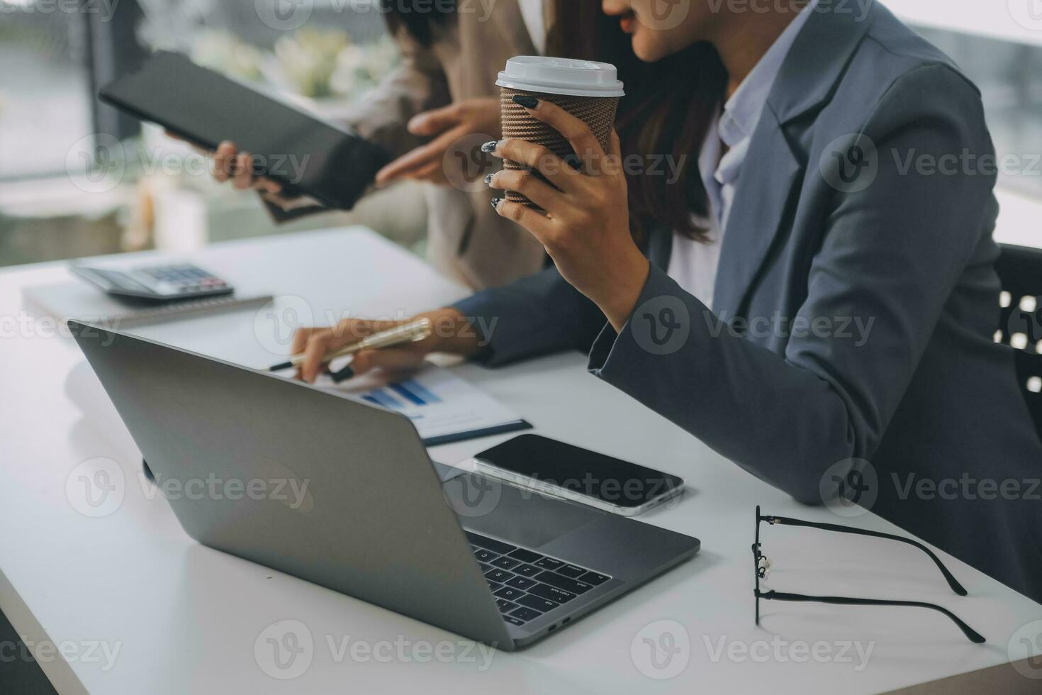Co working conference, Business team meeting present, investor colleagues discussing new plan financial graph data on office table with laptop and digital tablet, Finance, accounting, investment. photo