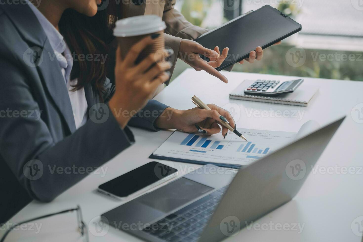 Co working conference, Business team meeting present, investor colleagues discussing new plan financial graph data on office table with laptop and digital tablet, Finance, accounting, investment. photo