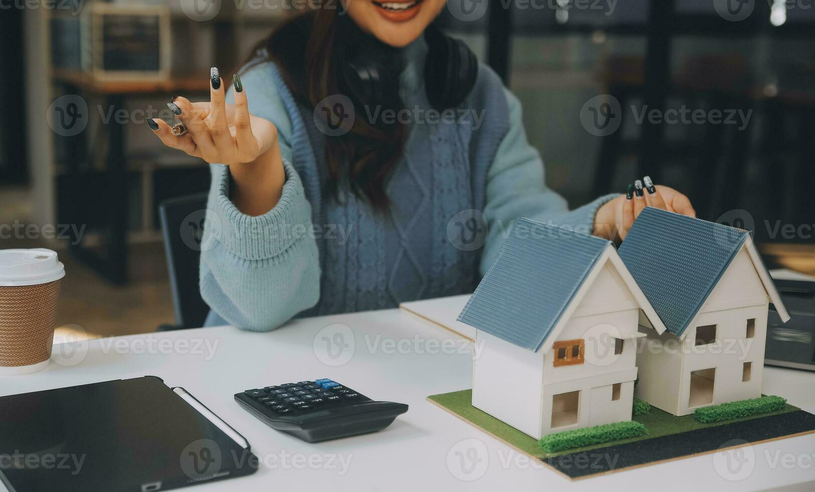 Real estate agent and customer discussing for contract to buy, get insurance or loan real estate or property. photo