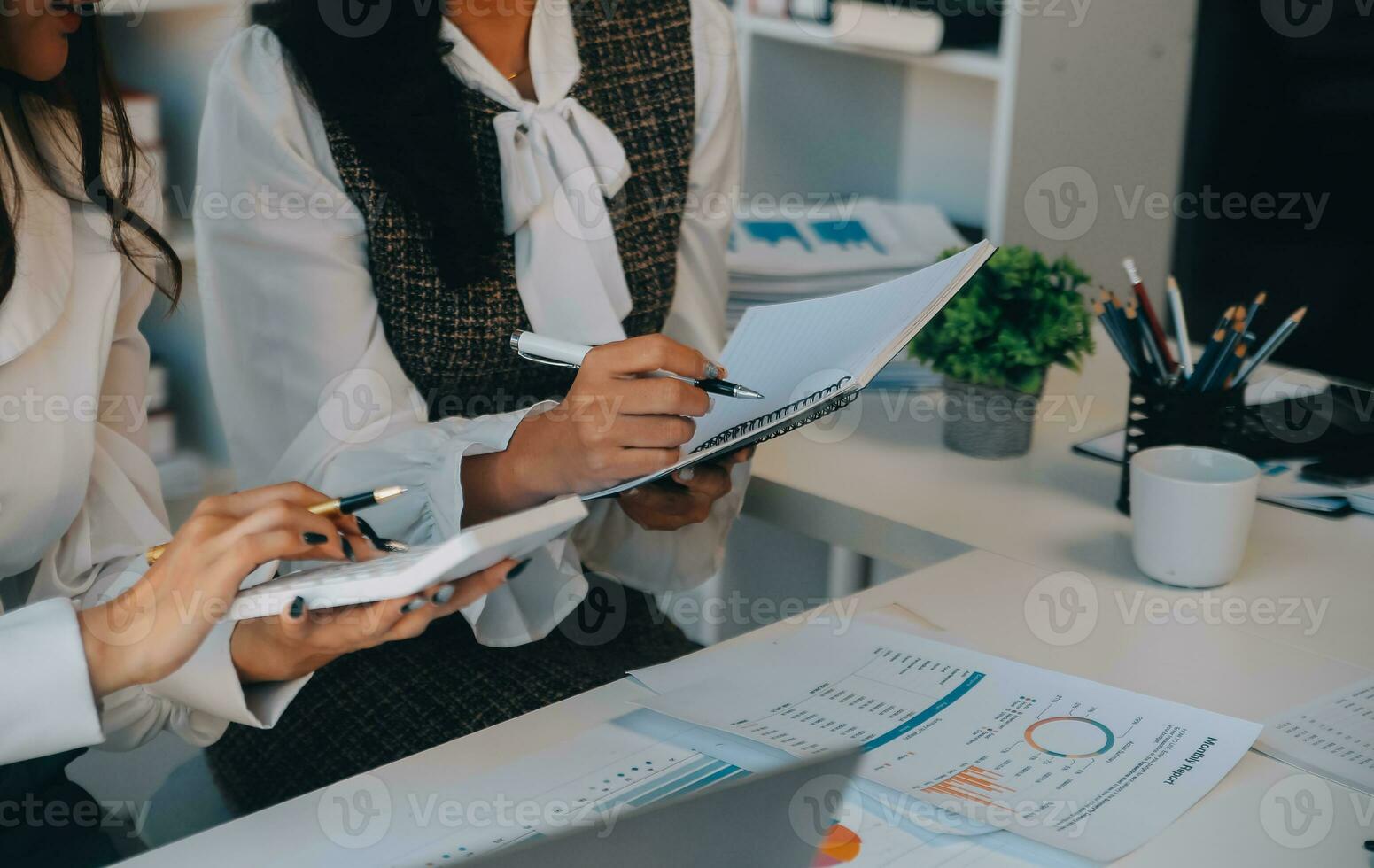 Business team collaboration discussing working analyzing with financial data and marketing growth report graph in team, presentation and brainstorming to strategy planning making profit of company. photo