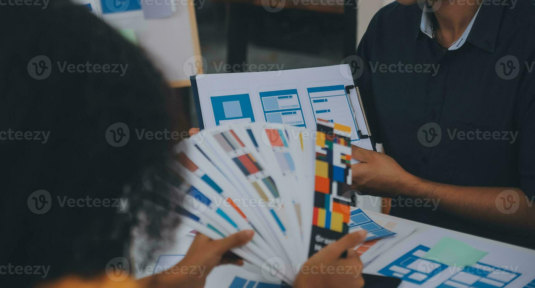 Close up ux developer and ui designer use augmented reality brainstorming about mobile app interface wireframe design on desk at modern office.Creative digital development agency photo