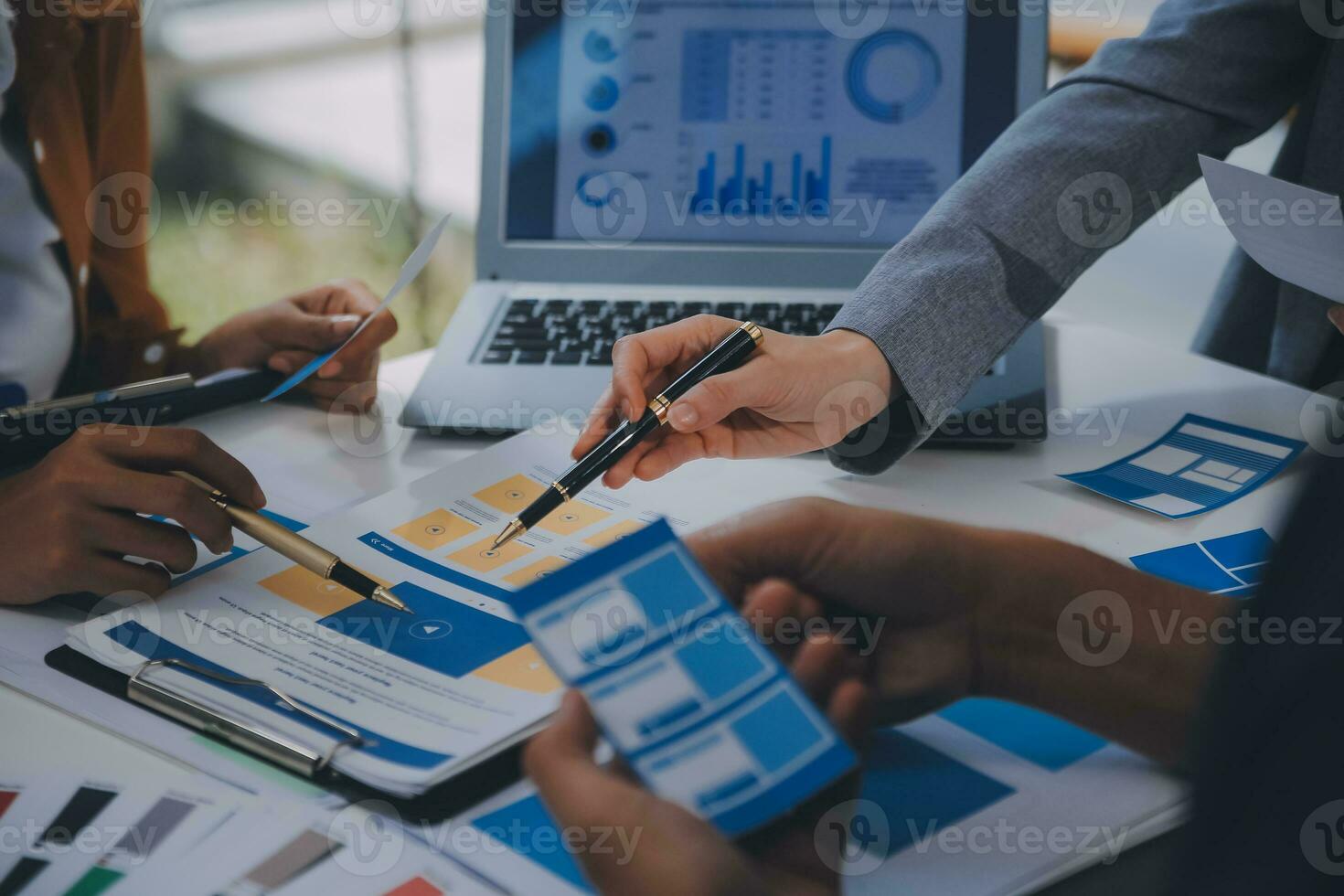 Close up ux developer and ui designer use augmented reality brainstorming about mobile app interface wireframe design on desk at modern office.Creative digital development agency photo