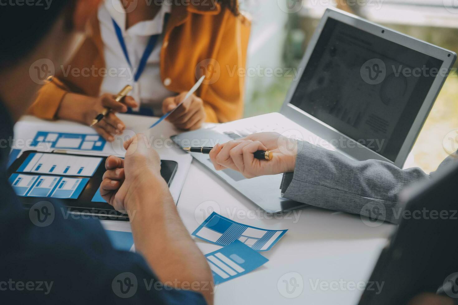 Close up ux developer and ui designer use augmented reality brainstorming about mobile app interface wireframe design on desk at modern office.Creative digital development agency photo