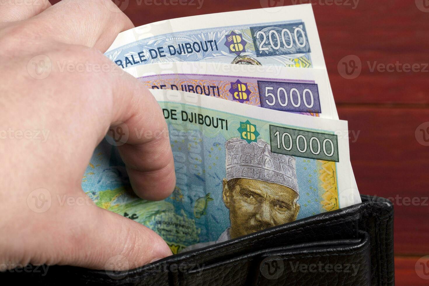 Djiboutian franc in the black wallet photo