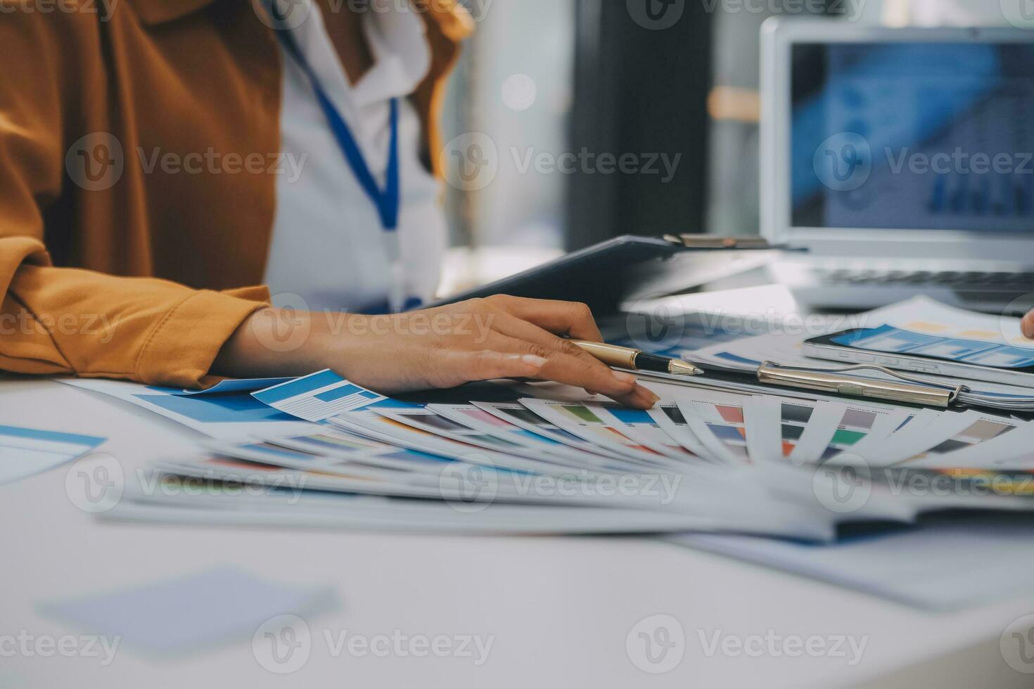 Close up ux developer and ui designer use augmented reality brainstorming about mobile app interface wireframe design on desk at modern office.Creative digital development agency photo