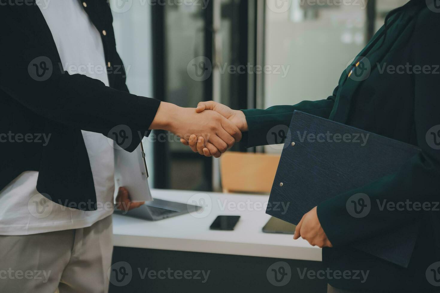 Businessmen join hands at the meeting to congratulate the company's big project on its success and its financial results have made a huge profit for the company, Finance concept. photo