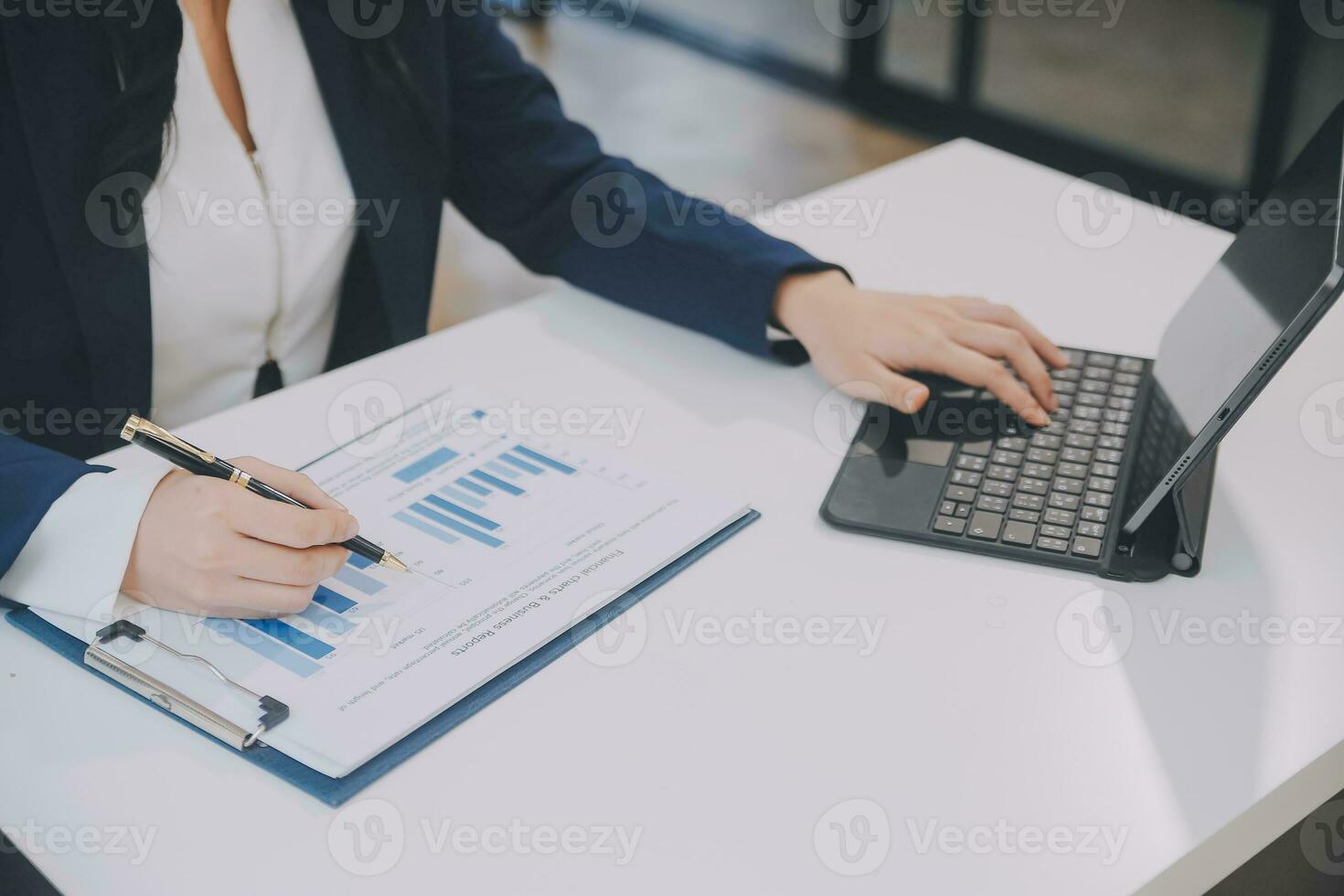Financial analysts analyze business financial reports on a digital tablet planning investment project during a discussion at a meeting of corporate showing the results of their successful teamwork. photo