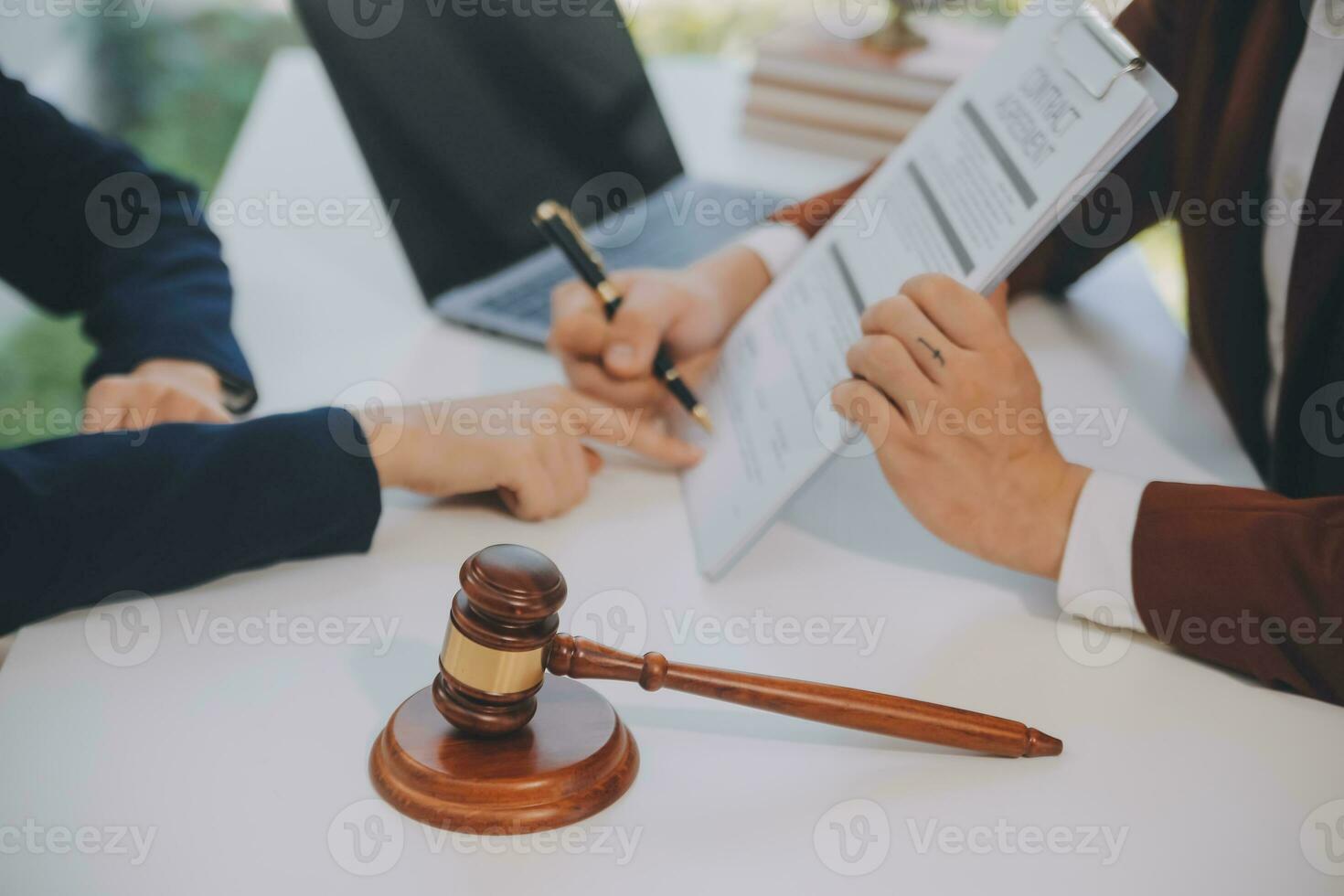 Lawyer, legal advisor, businessman brainstorming information on agreement details Business contracts in legal processing books for accuracy in contract documents. joint financial investment. photo