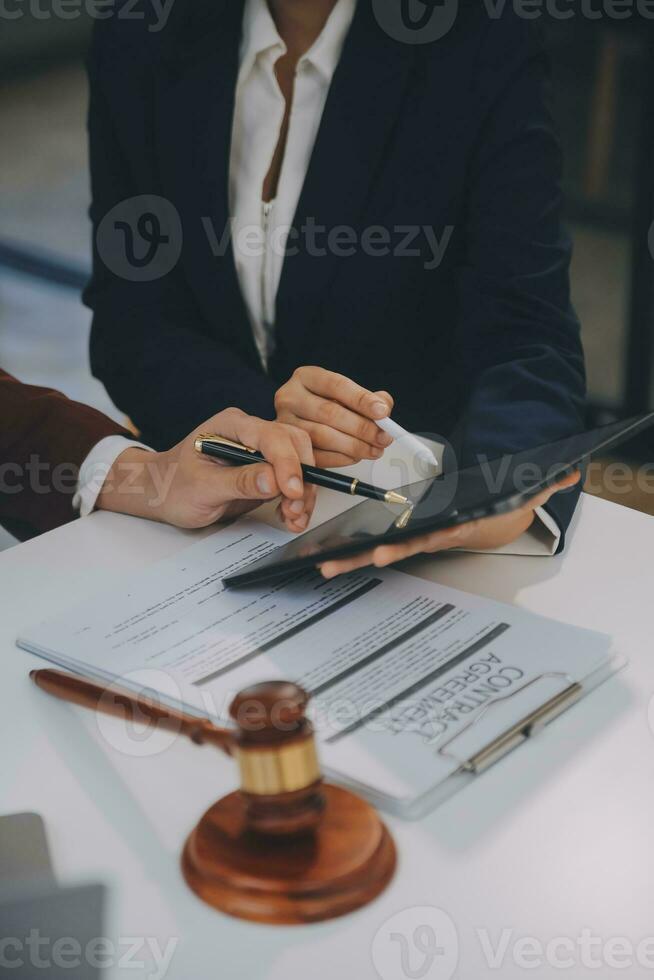 Lawyer, legal advisor, businessman brainstorming information on agreement details Business contracts in legal processing books for accuracy in contract documents. joint financial investment. photo