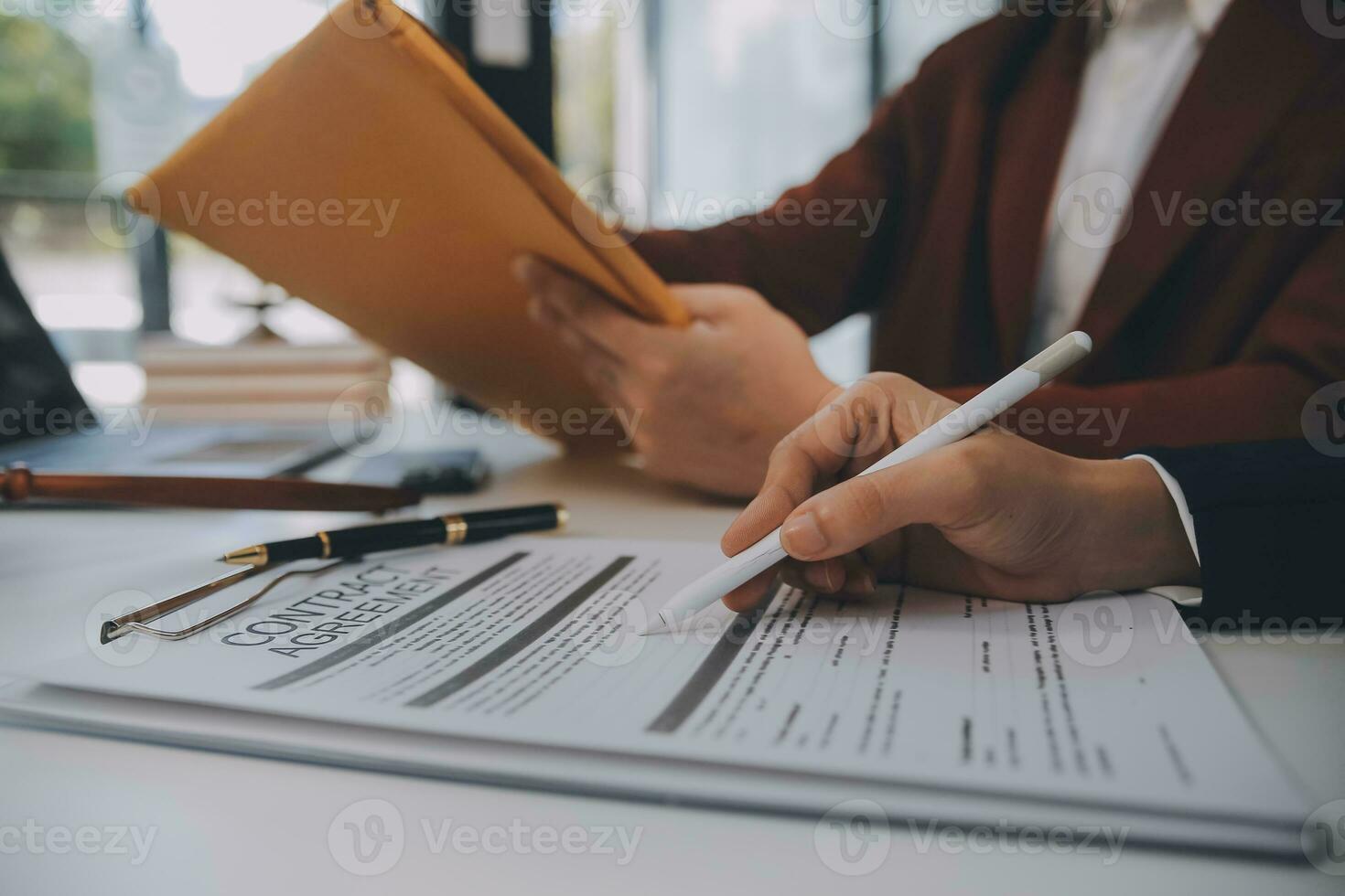 Lawyer, legal advisor, businessman brainstorming information on agreement details Business contracts in legal processing books for accuracy in contract documents. joint financial investment. photo