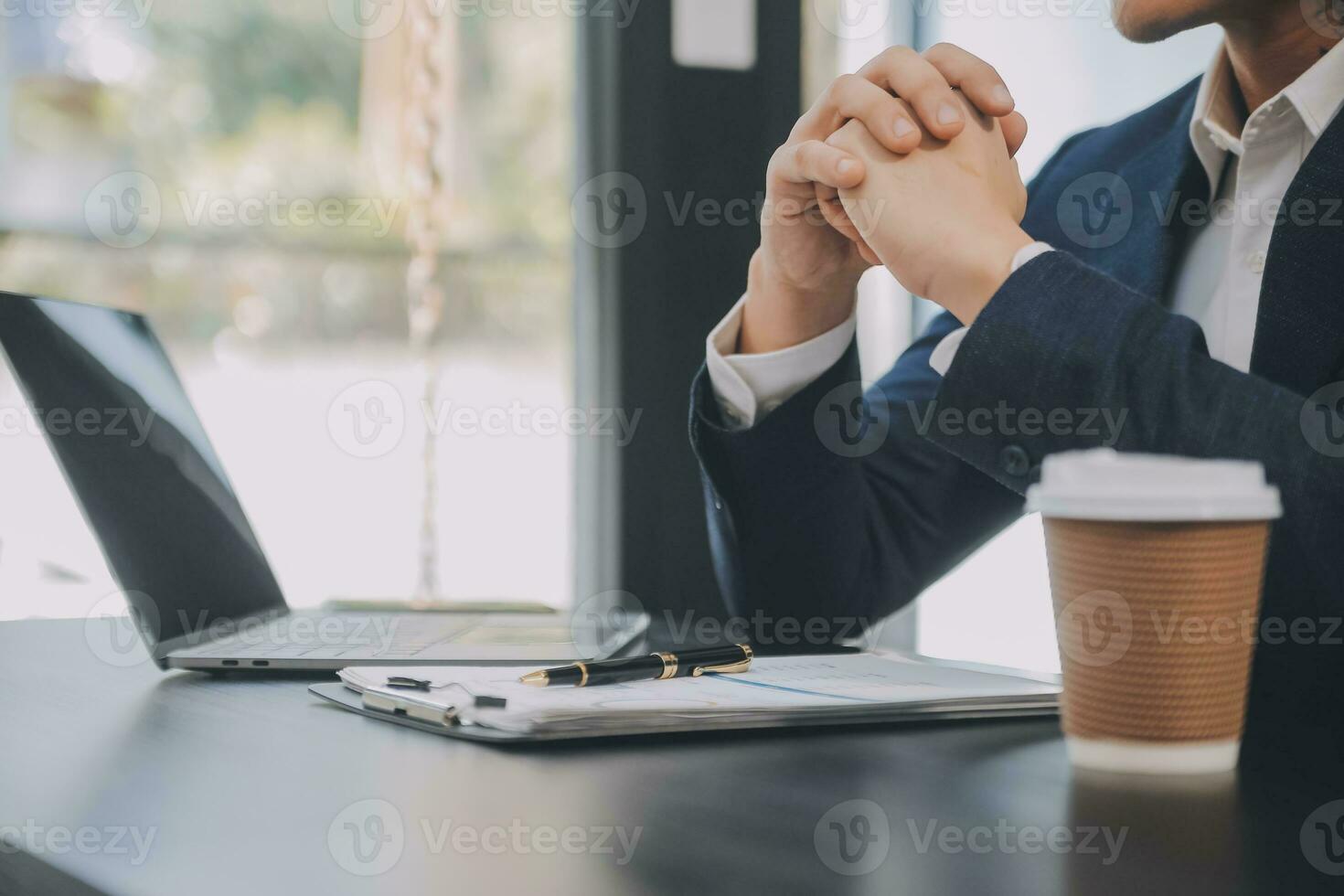 Financial analysts analyze business financial reports on a digital tablet planning investment project during a discussion at a meeting of corporate showing the results of their successful teamwork. photo