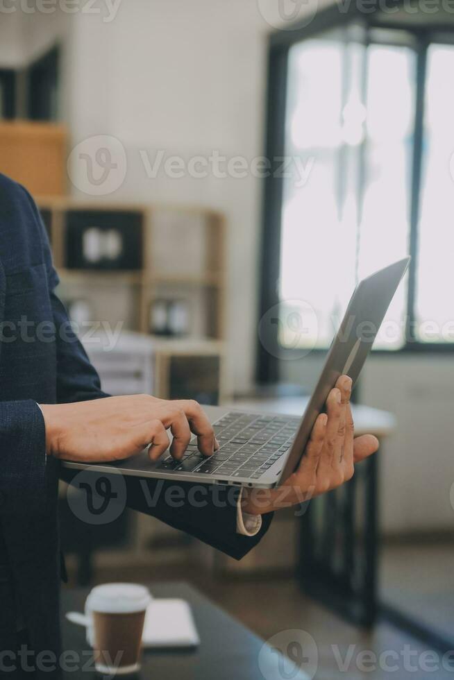 Financial analysts analyze business financial reports on a digital tablet planning investment project during a discussion at a meeting of corporate showing the results of their successful teamwork. photo