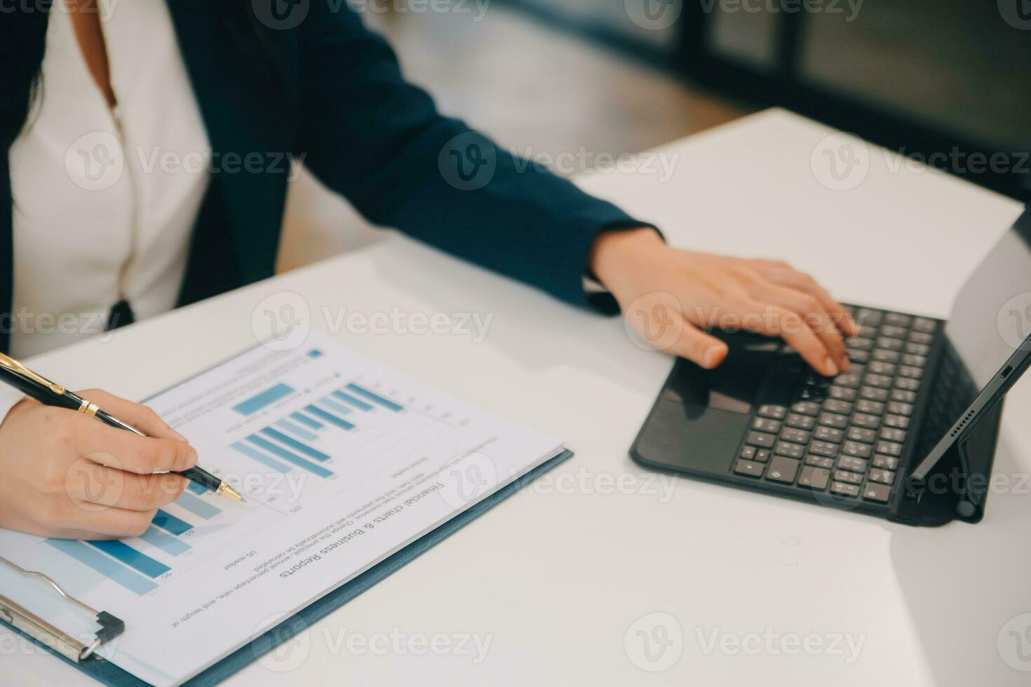 Financial analysts analyze business financial reports on a digital tablet planning investment project during a discussion at a meeting of corporate showing the results of their successful teamwork. photo