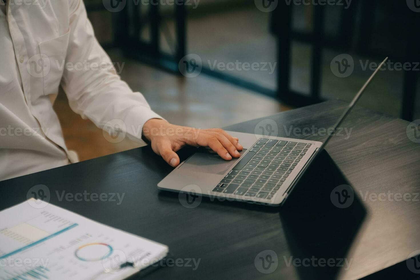 Entrepreneur Asian businessman and businesswoman discussing new business project in tablet in modern Meeting In Modern Office, Asian business casual concept. photo