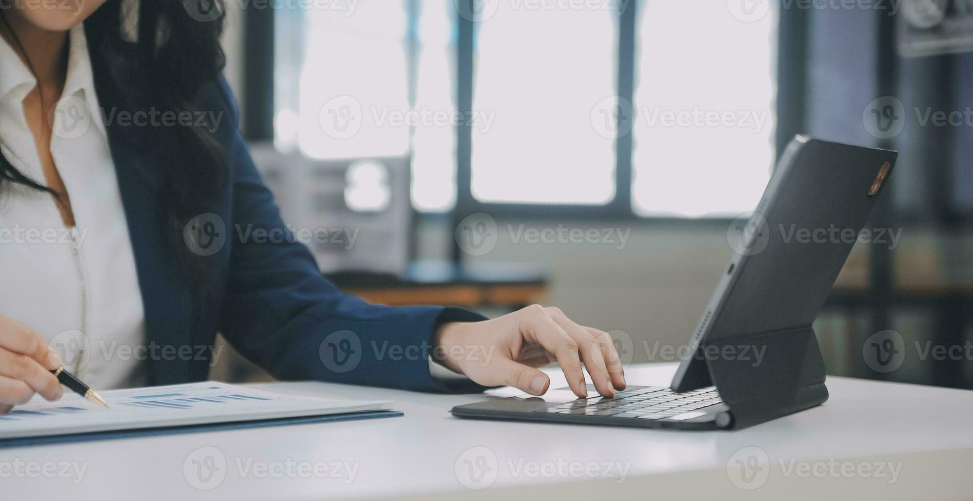 Financial analysts analyze business financial reports on a digital tablet planning investment project during a discussion at a meeting of corporate showing the results of their successful teamwork. photo