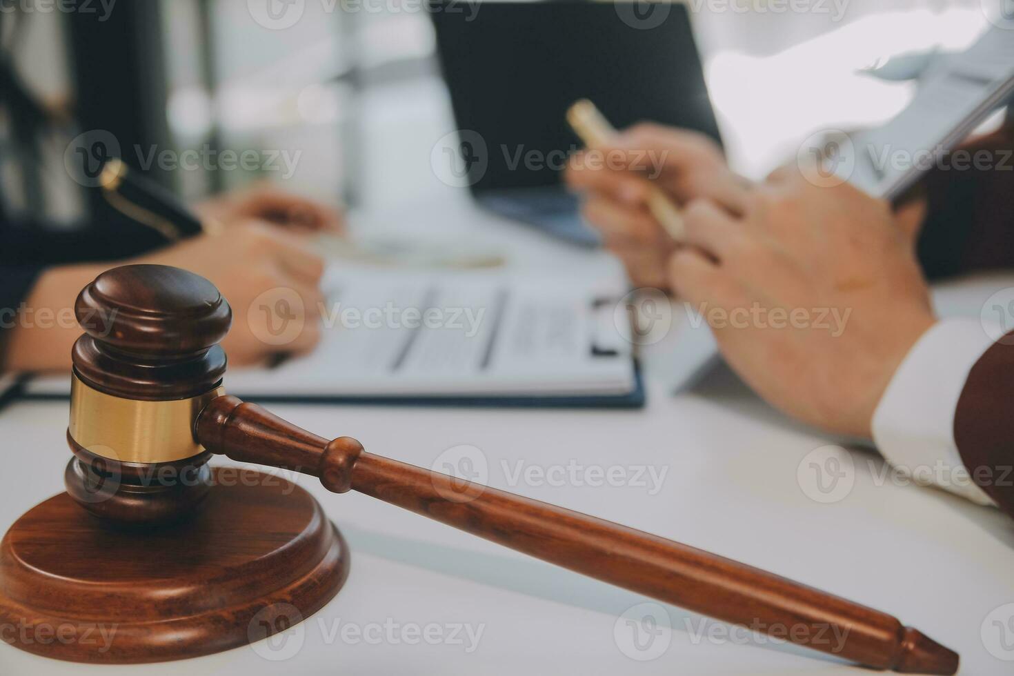 Lawyer, legal advisor, businessman brainstorming information on agreement details Business contracts in legal processing books for accuracy in contract documents. joint financial investment. photo