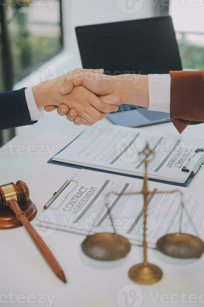 Lawyer, legal advisor, businessman brainstorming information on agreement details Business contracts in legal processing books for accuracy in contract documents. joint financial investment. photo