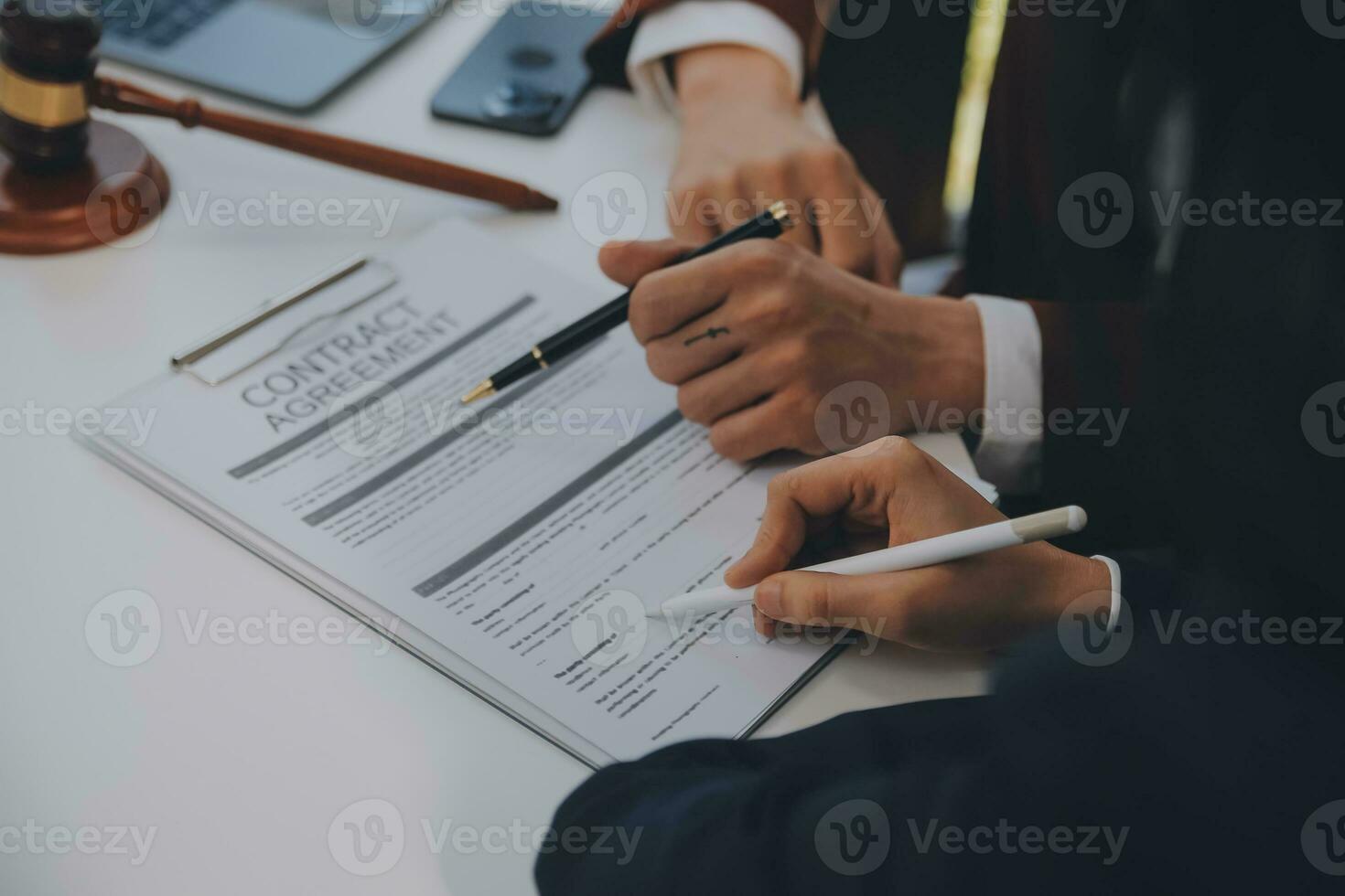 Lawyer, legal advisor, businessman brainstorming information on agreement details Business contracts in legal processing books for accuracy in contract documents. joint financial investment. photo