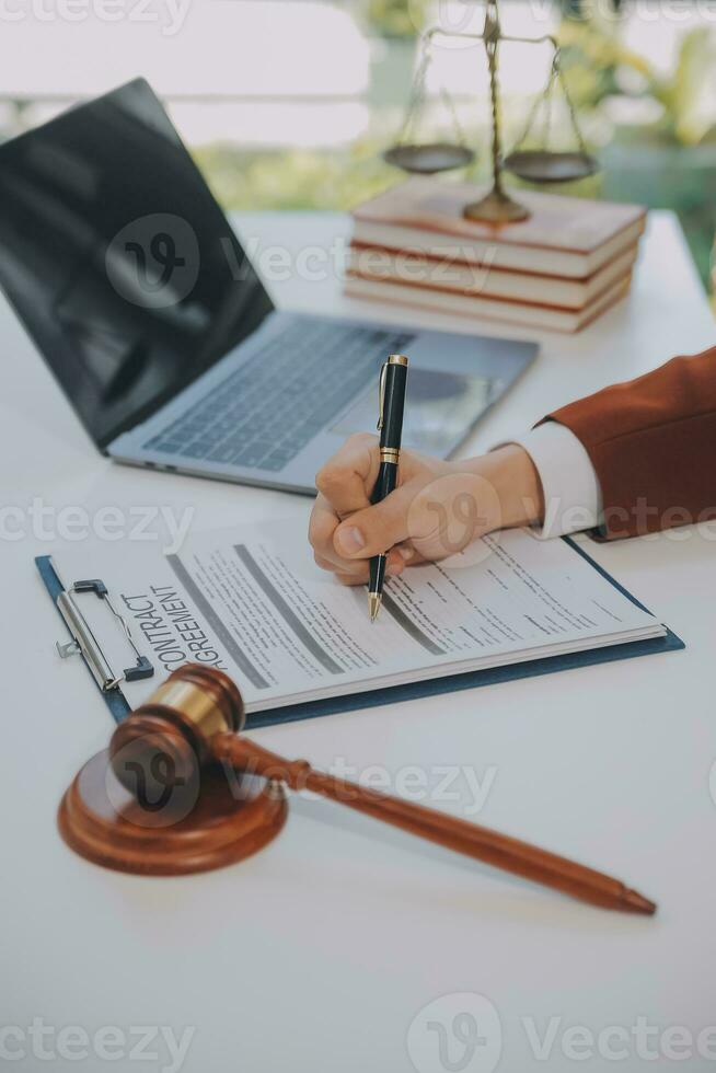 Lawyer, legal advisor, businessman brainstorming information on agreement details Business contracts in legal processing books for accuracy in contract documents. joint financial investment. photo