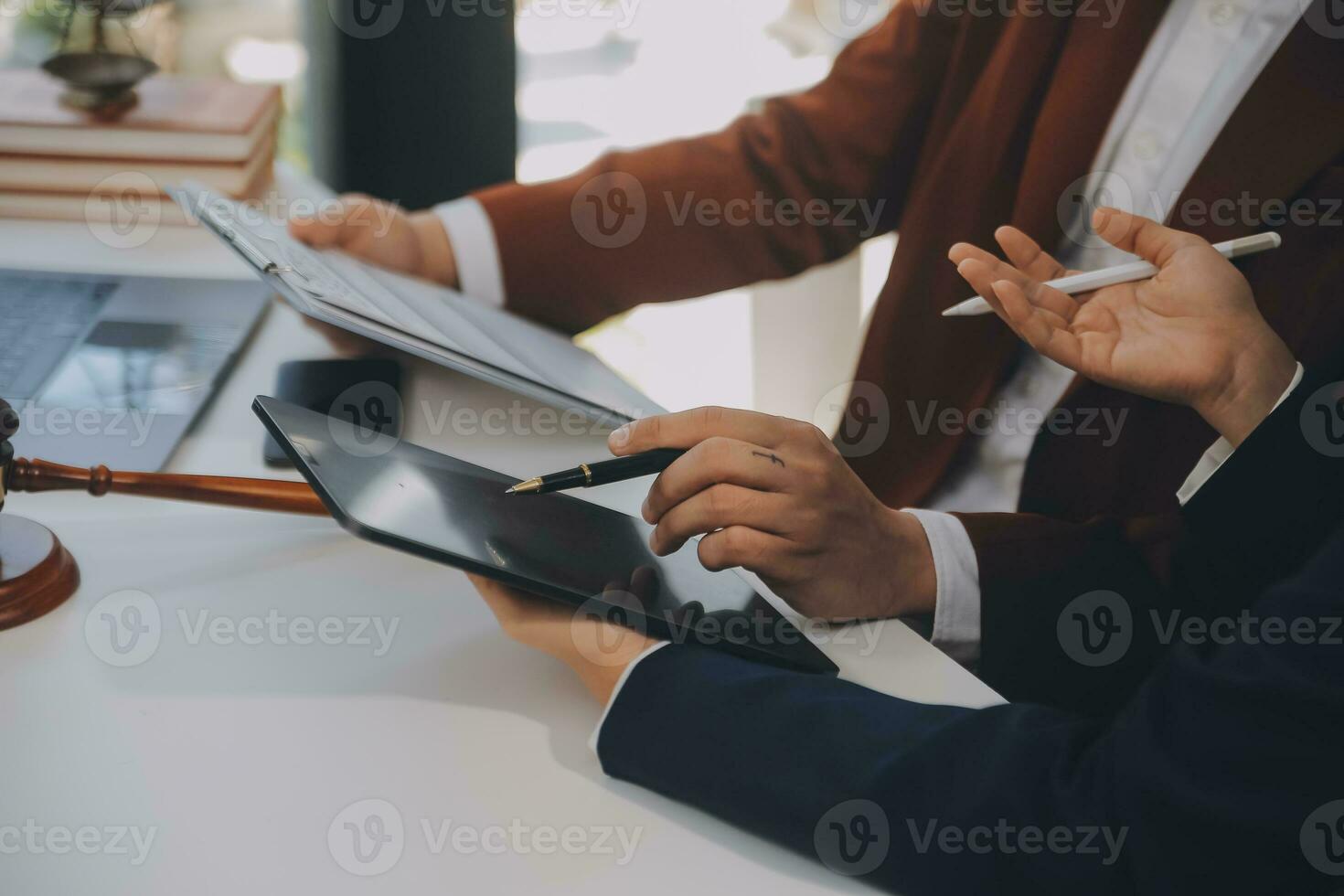 Lawyer, legal advisor, businessman brainstorming information on agreement details Business contracts in legal processing books for accuracy in contract documents. joint financial investment. photo