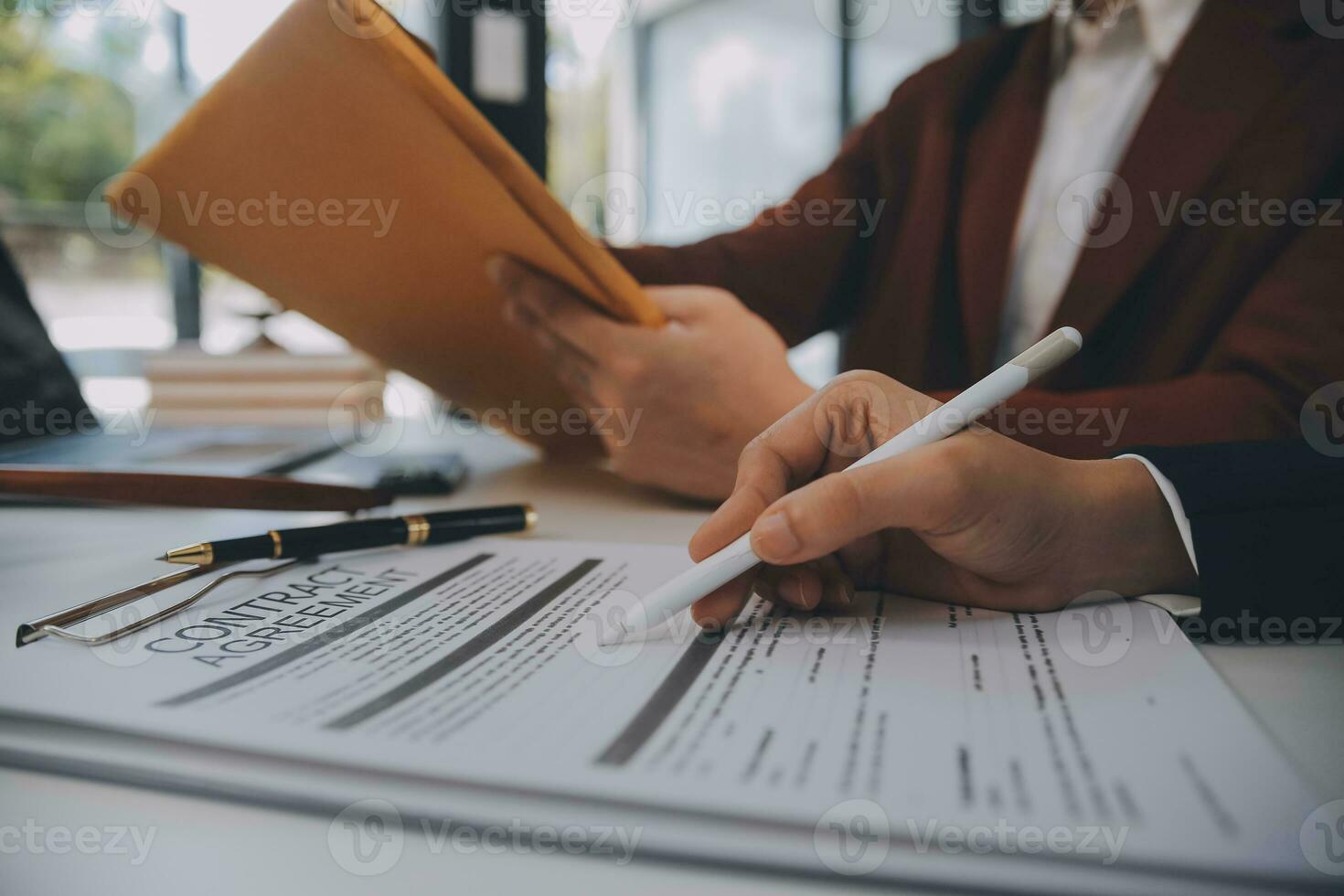 Lawyer, legal advisor, businessman brainstorming information on agreement details Business contracts in legal processing books for accuracy in contract documents. joint financial investment. photo