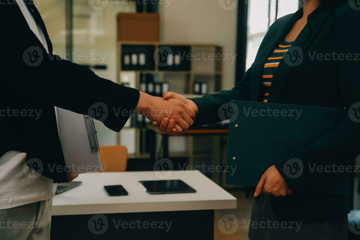 Businessmen join hands at the meeting to congratulate the company's big project on its success and its financial results have made a huge profit for the company, Finance concept. photo