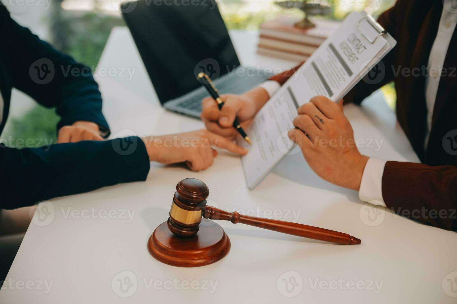 Lawyer, legal advisor, businessman brainstorming information on agreement details Business contracts in legal processing books for accuracy in contract documents. joint financial investment. photo