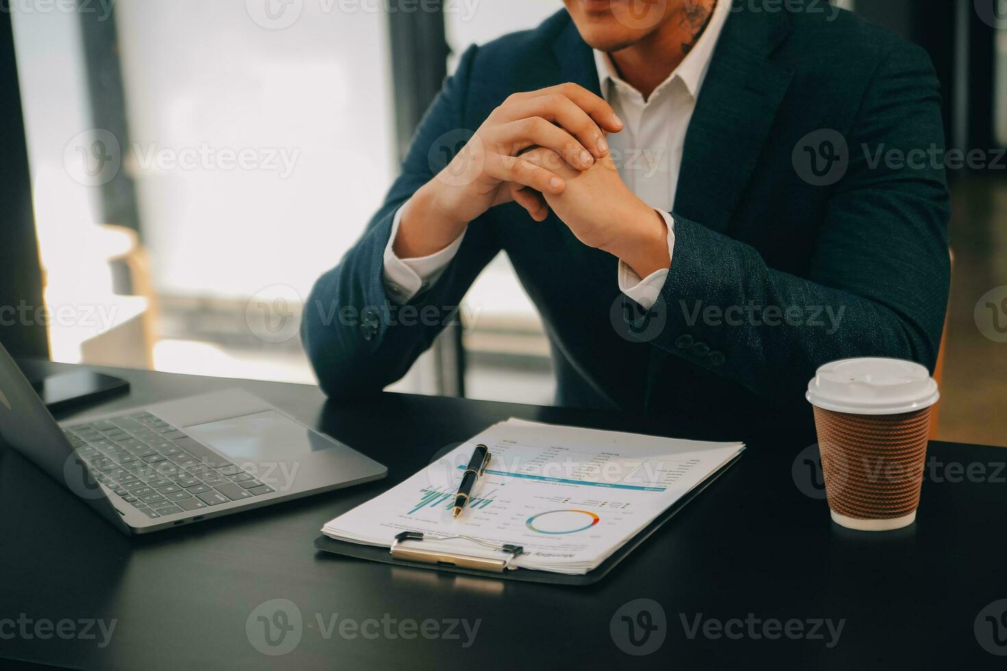 Financial analysts analyze business financial reports on a digital tablet planning investment project during a discussion at a meeting of corporate showing the results of their successful teamwork. photo