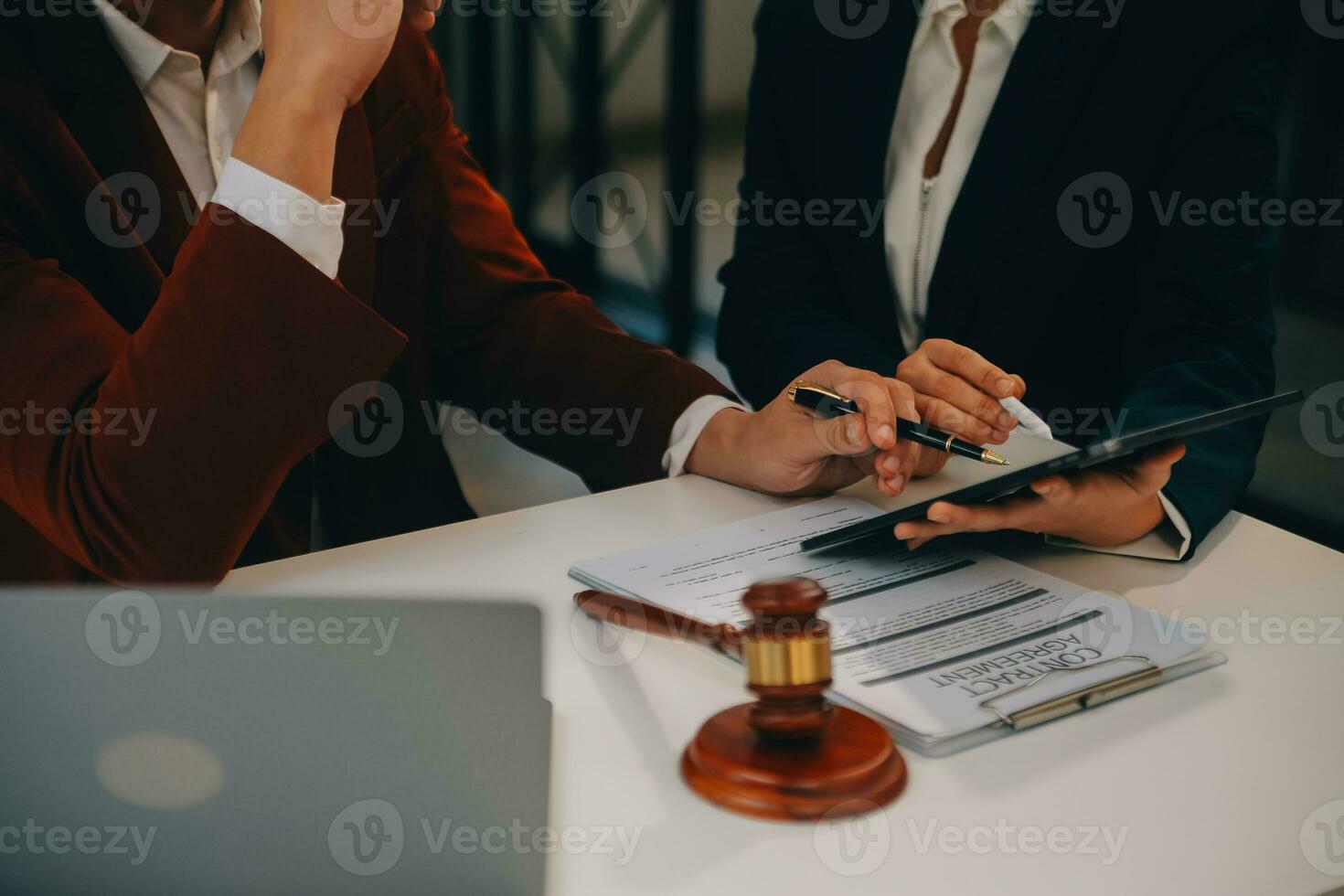 Lawyer, legal advisor, businessman brainstorming information on agreement details Business contracts in legal processing books for accuracy in contract documents. joint financial investment. photo
