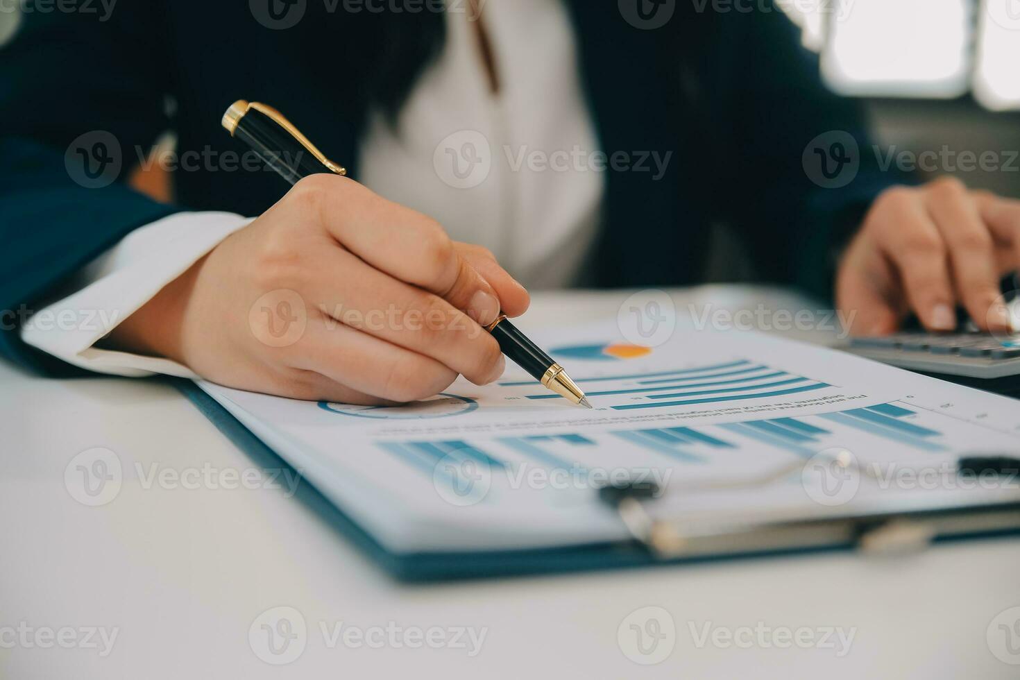 Financial analysts analyze business financial reports on a digital tablet planning investment project during a discussion at a meeting of corporate showing the results of their successful teamwork. photo