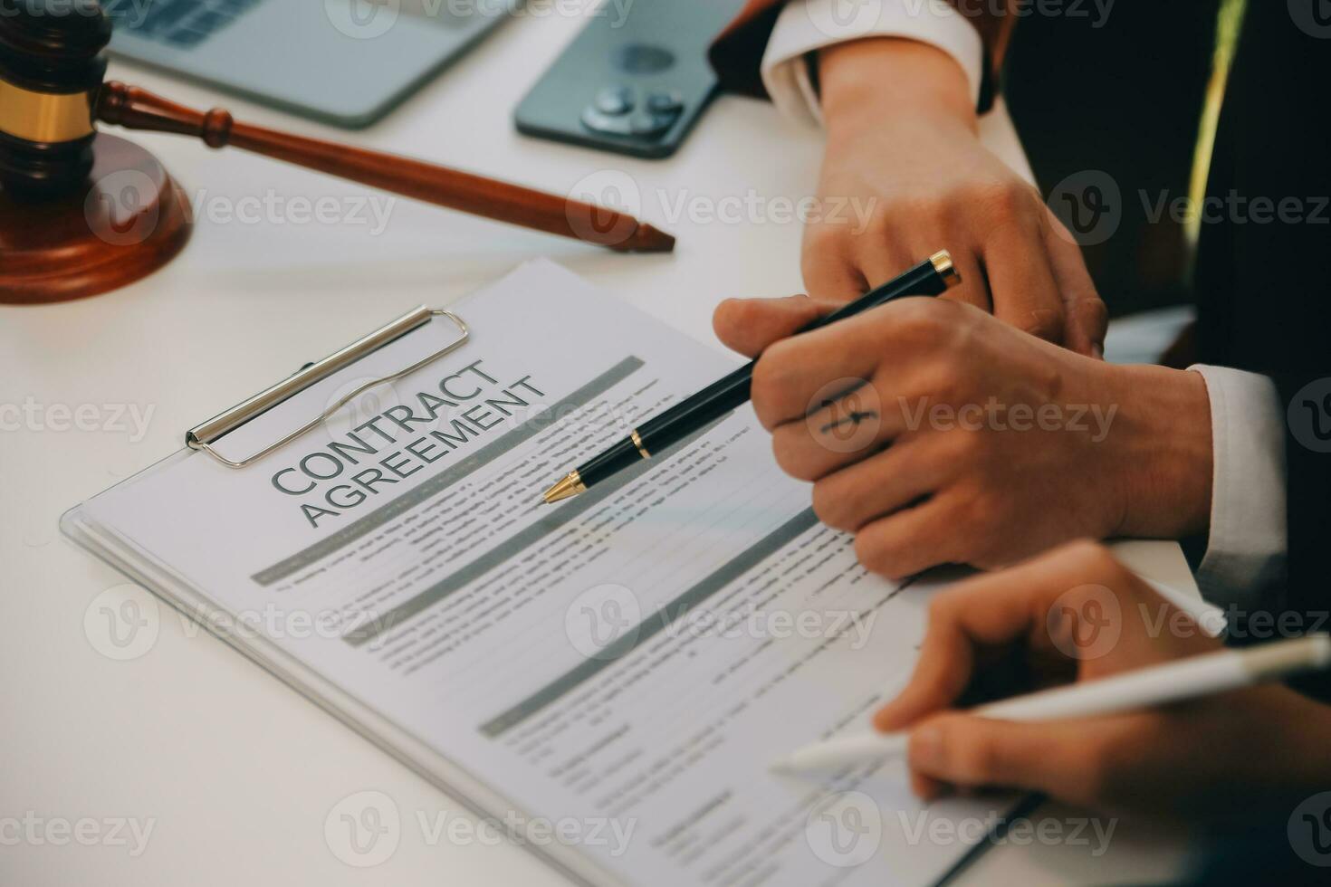 Lawyer, legal advisor, businessman brainstorming information on agreement details Business contracts in legal processing books for accuracy in contract documents. joint financial investment. photo