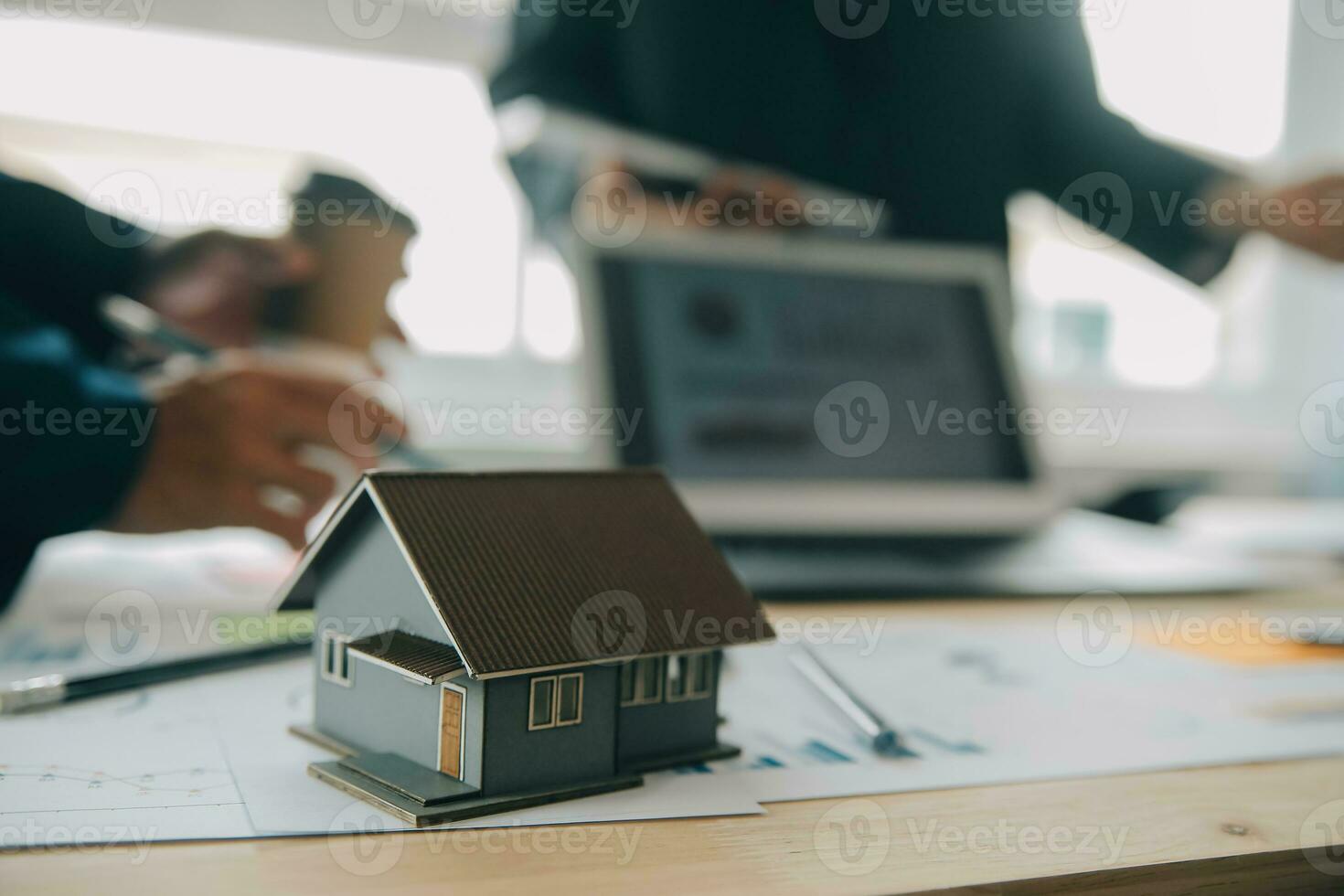 Financial analysts analyze business financial reports on a digital tablet planning investment project during a discussion at a meeting of corporate showing the results of their successful teamwork. photo
