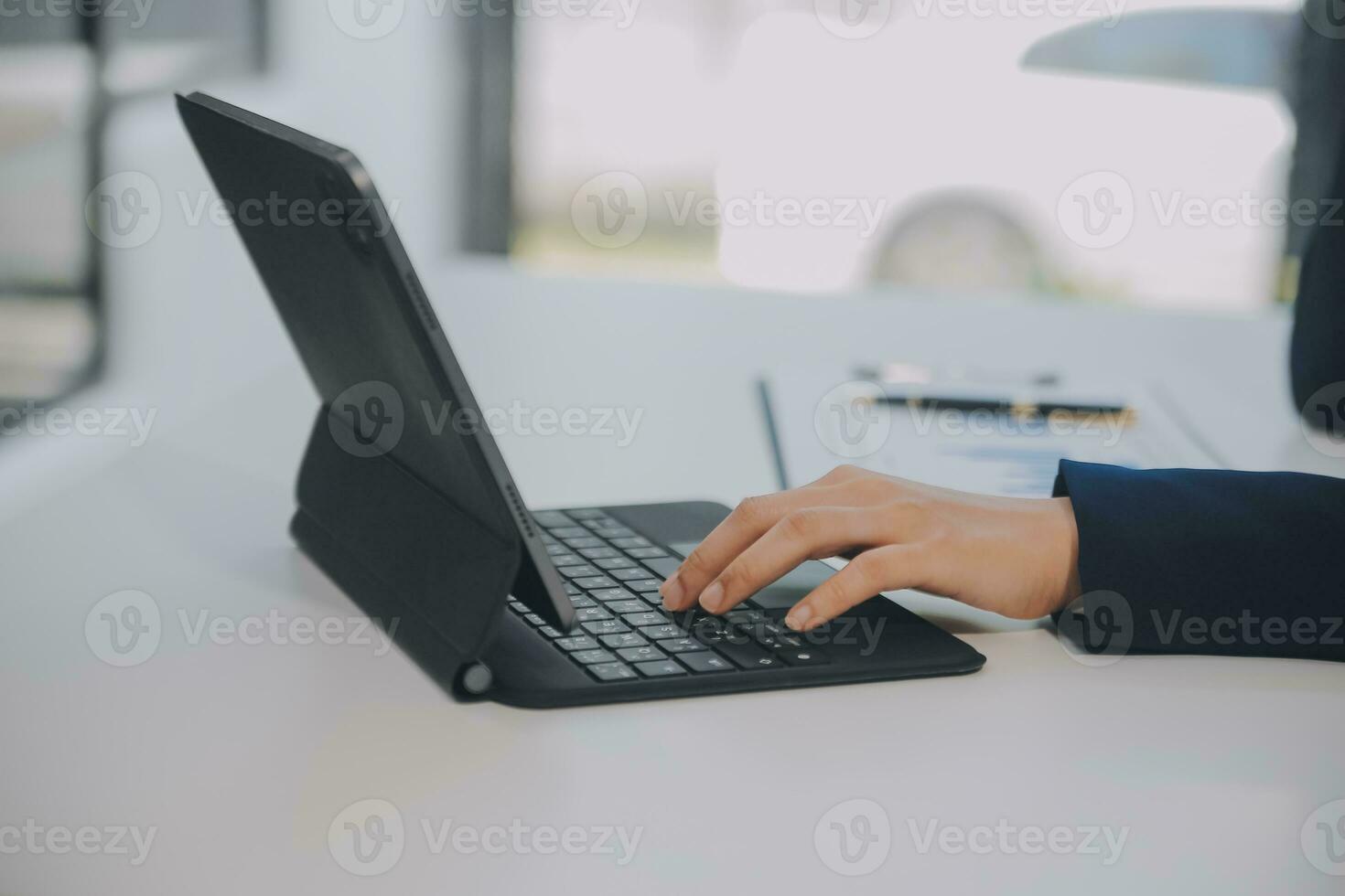 Financial analysts analyze business financial reports on a digital tablet planning investment project during a discussion at a meeting of corporate showing the results of their successful teamwork. photo