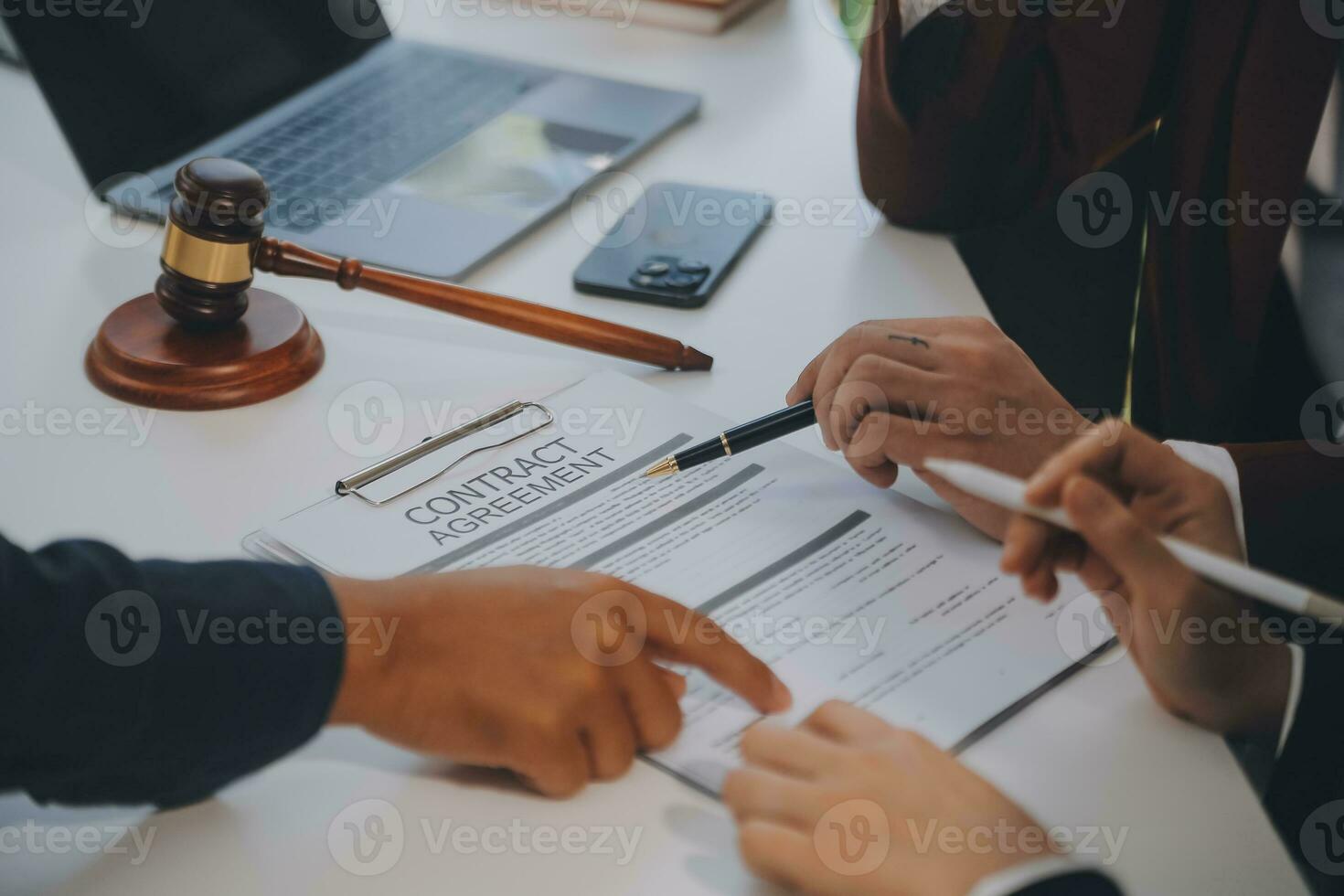 Lawyer, legal advisor, businessman brainstorming information on agreement details Business contracts in legal processing books for accuracy in contract documents. joint financial investment. photo